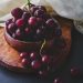 photography of red grapes on bowl