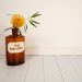 yellow sunflower in glass bottle