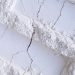 a white brick wall with a crack in it